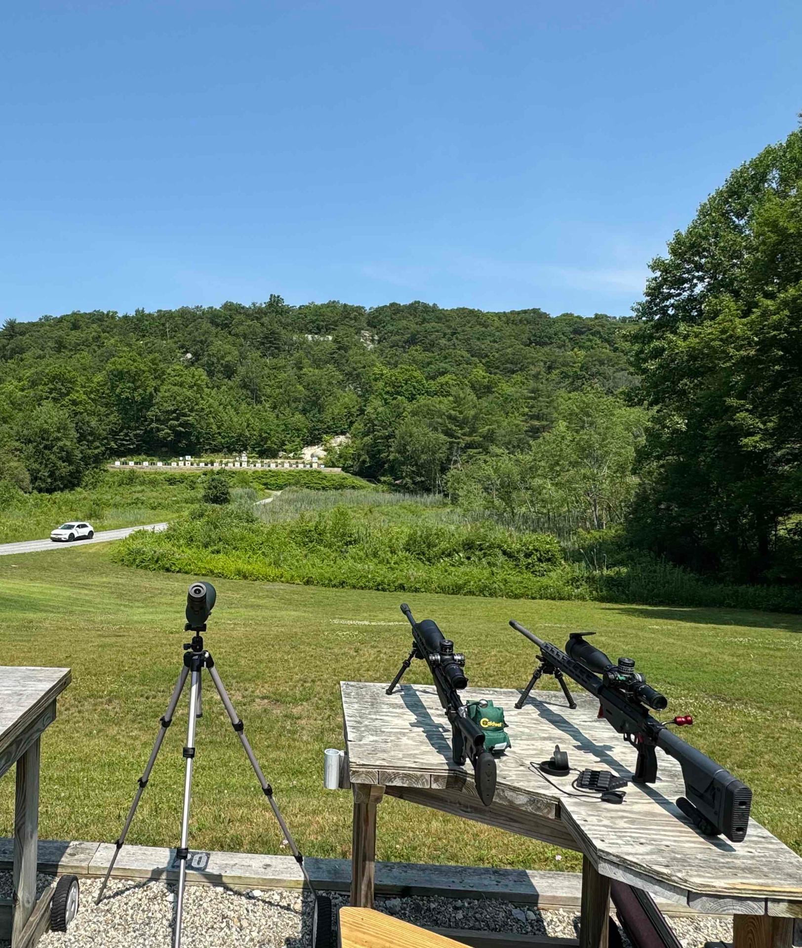 Long-range rifles set up with a spotting scope on a 200-yard rifle line at Cherry Ridge