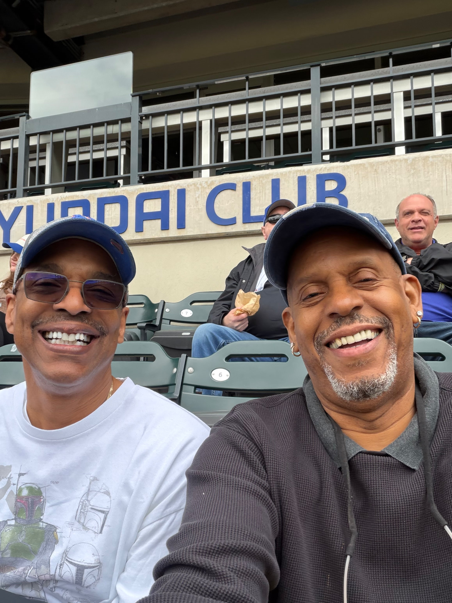 The instructor and a friend at a ballgame
